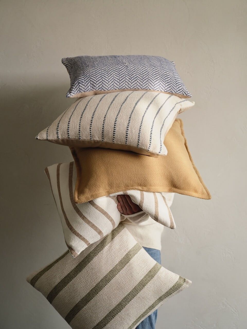 Soft textiles arranged in a calm interior setting
